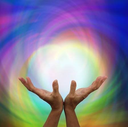 28137013-outstretched-healing-on-rainbow-energy-colour-background.jpg