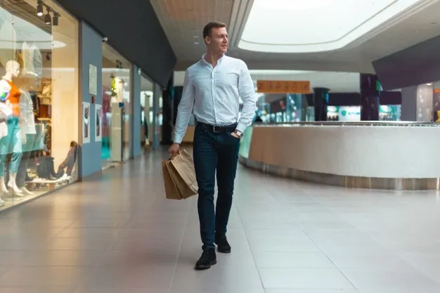 young-stylish-man-walking-mall-with-ecology-friendly-shopping-bags-hand-with-goods-clothes-sales-discount-sold-out-concept-seasonal-sell-out_243724-1044.webp