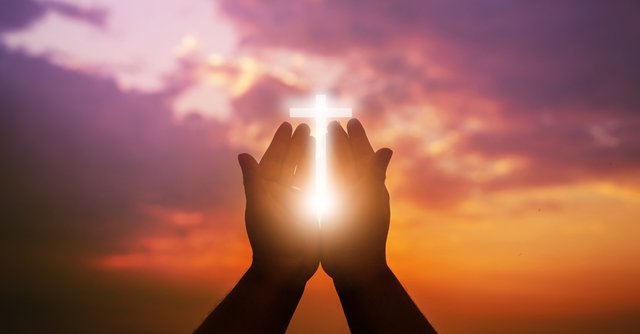 17718-light-cross-lifted-hands.jpg