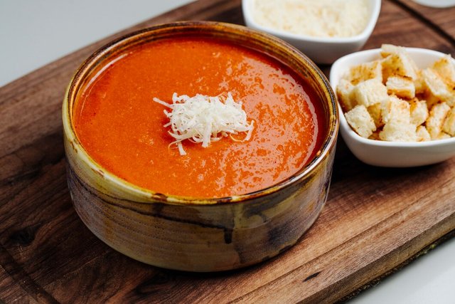 tomato-soup-topped-with-cheese-side-crackers_141793-844.jpg