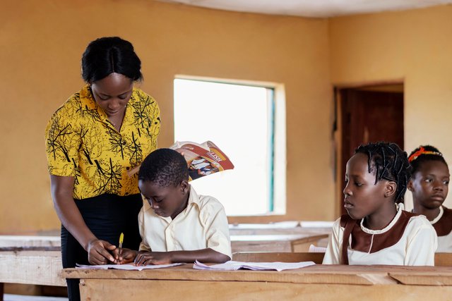 african-woman-teaching-children-class.jpg