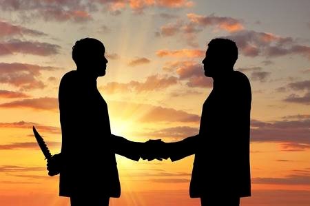 52302066-concept-of-business-betrayal-silhouette-of-two-businessmen-shaking-hands-and-keep-arms-behind-his-ba.jpg