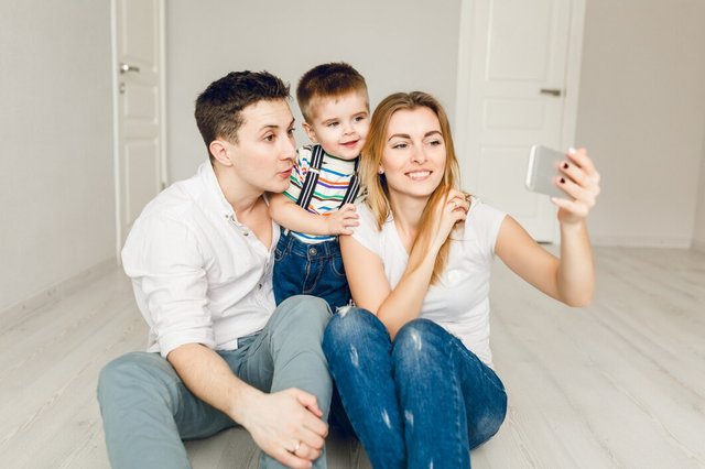 family-picture-two-young-parents-playing-with-their-boy-child_197531-162.jpg