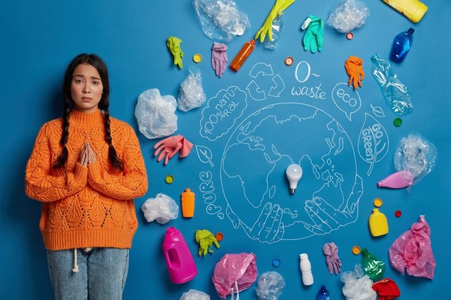 ecology-land-conservation-concept-sad-asian-woman-stands-praying-pose-surrounded-with-plastic-waste-begs-help-cleaning-earth-dressed-casually_273609-34656.jpg