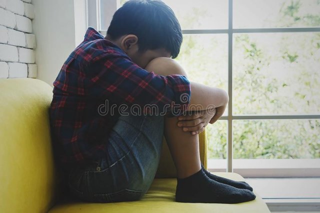 little-asian-boy-sad-depressed-sitting-room-next-window-abuse-concept-142201510.jpg