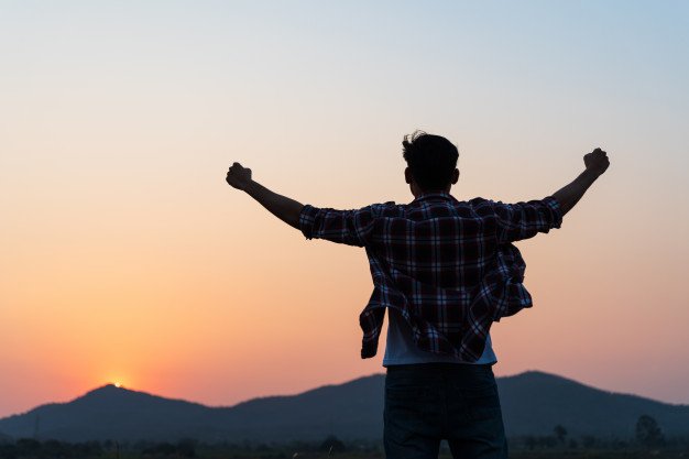 man-with-fist-air-during-sunset-feeling-motivated-freedom-concept_53476-4832.jpg