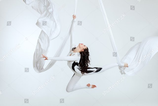 stock-photo-aerial-artistic-acrobatics-a-woman-demonstrates-poses-776475187.jpg