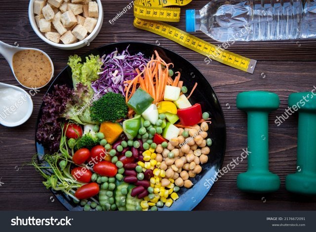 stock-photo-diet-and-healthy-life-loss-weight-exercise-concept-fresh-vegetable-salad-with-weight-scale-measure-2176672091.jpg