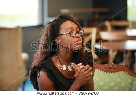 stock-photo-charming-african-american-woman-keeping-hands-clasped-and-eyes-closed-while-praying-790794760.jpg