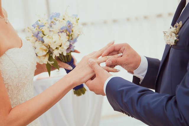 wedding-rings-being-exchanged-ceremony-40920002.jpg