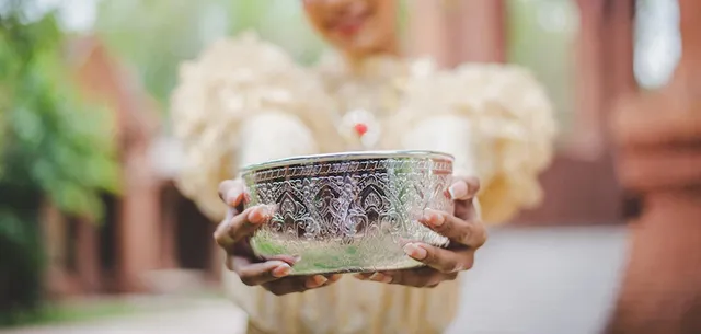 selective-focus-female-hands-holding-water-bowl-temples-preserve-good-culture-thai-people-songkran-festival-thai-new-year-family-day-april_1150-61270.webp