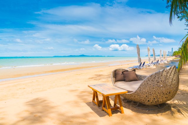 chair-and-table-dinning-on-the-beach-and-sea-with-blue-sky.jpg