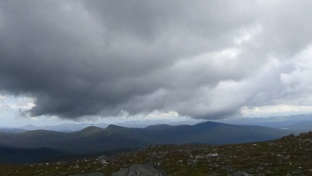 60 Thick dark clouds at summit, with Schiehallion in distance.jpg