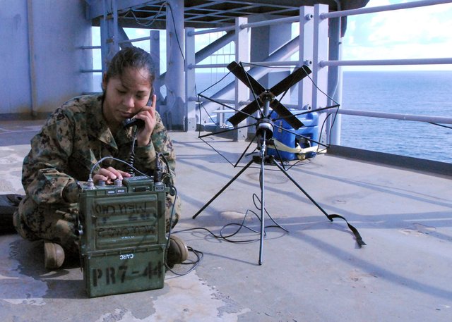 US_Navy_071211-N-1924T-035_Marine_Lance_Cpl._Christine_Salazar,_a_member_of_the_24th_Marine_Expeditionary_Unit,_uses_a_PRC-117_radio_and_SATCOM_antenna_to_receive_communications_while_aboard_the_amphibious_assault_shi.jpg