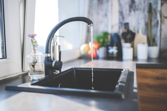 black tap running in a kitchen sink.jpg