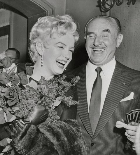 actress-marilyn-monroe-laughs-heartily-with-jack-warner-news-photo-517448584-1562959295.jpg