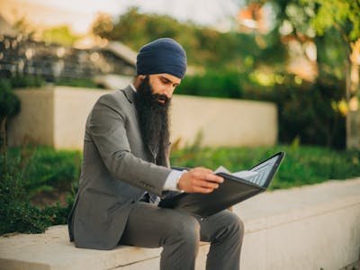 free-photo-of-man-with-a-beard-reading-documents.jpeg