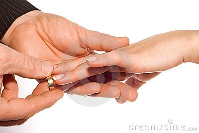 man-putting-wedding-ring-bride-s-finger-8317184.jpg
