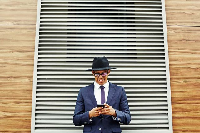 businessman-with-mobile-phone-PM3FUKN.jpg