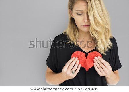 girl-holding-broken-heart-concept-450w-532276495.jpg