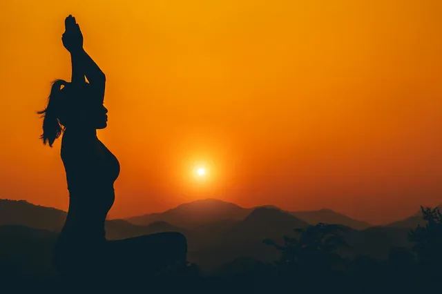 silhouette-yoga-girl-is-practicing-rooftop-while-sunset_1150-21839.webp