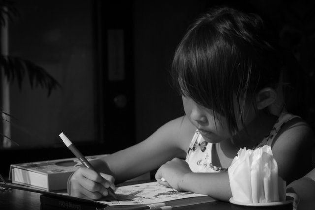 little girl drawing bw.jpg