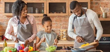 mom-and-daughter-watching-dad-while-cooking.jpg