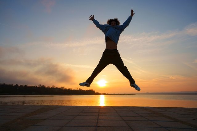 full-shot-man-silhouette-jumping-sunset_23-2150343126.jpg