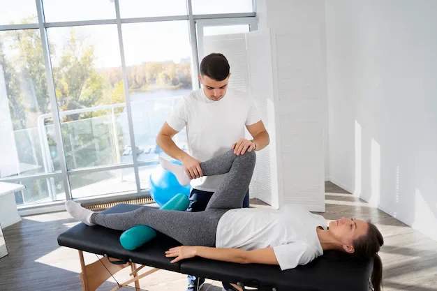 physiotherapist-helping-patient-full-shot_23-2149173482.webp