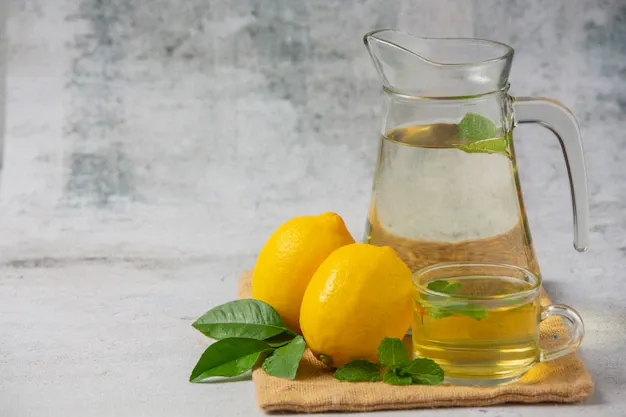 fresh-lemon-lemon-juice-glass-jar_1150-20462.webp