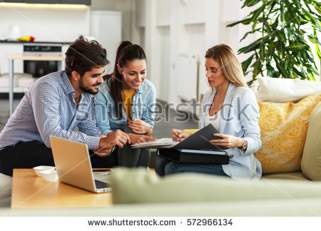 stock-photo-female-real-estate-agent-offer-home-ownership-and-life-insurance-to-young-couple-572966134.jpg