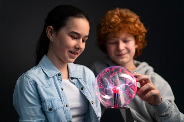 medium-shot-kids-interacting-with-plasma-ball_23-2150591668.jpg