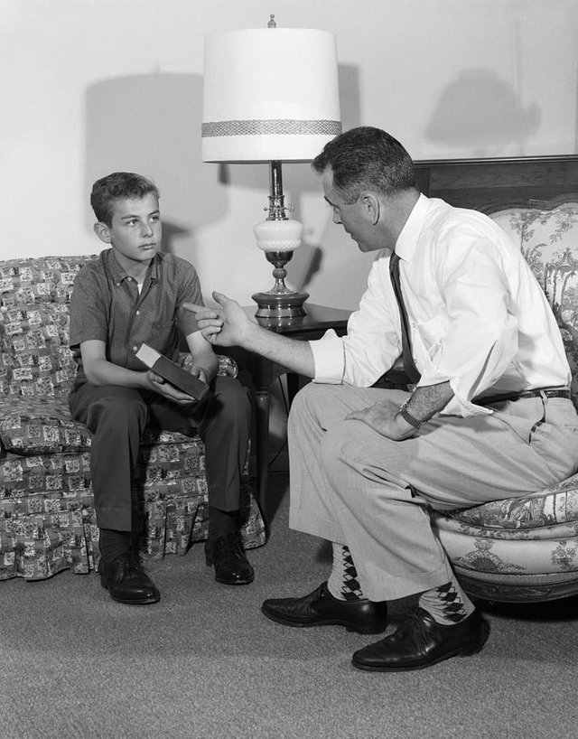 father-and-son-having-serious-talk-h-armstrong-robertsclassicstock.jpg