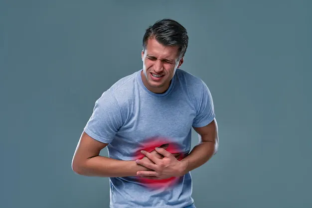 man-white-t-shirt-with-stomachache-gray-room_189498-61.webp