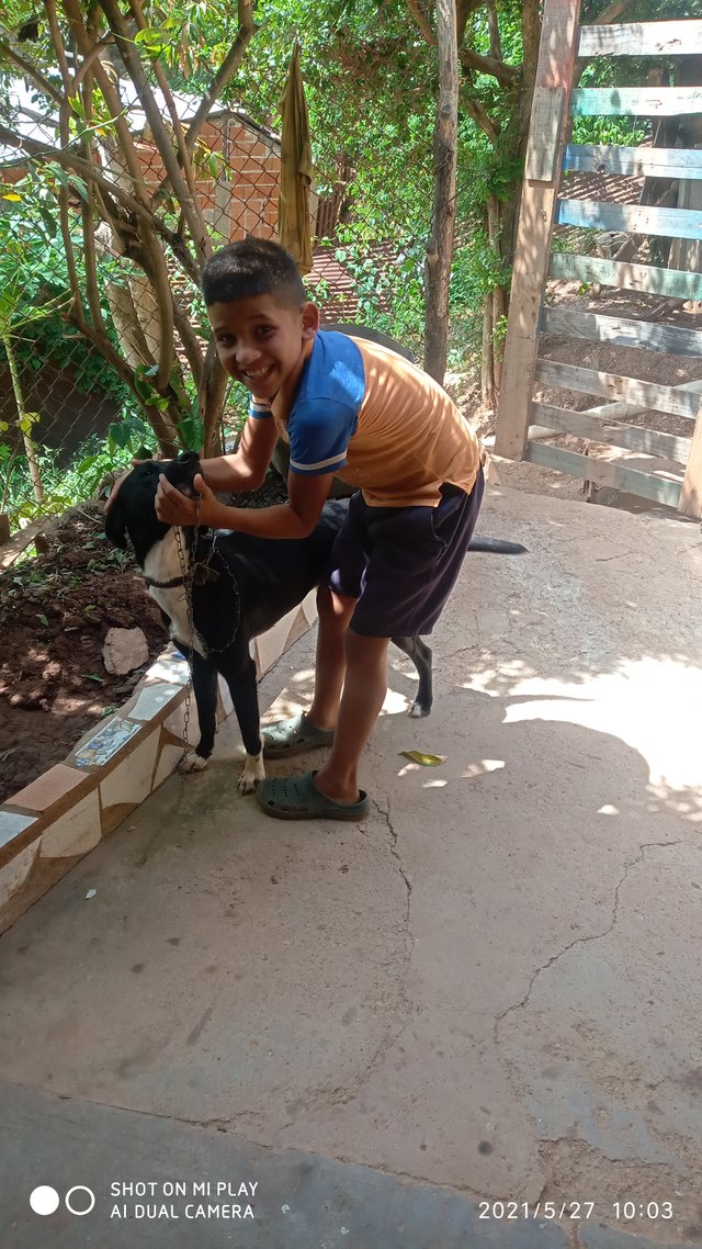 mi hijo pasiando al consentido de la casa tobi.jpg