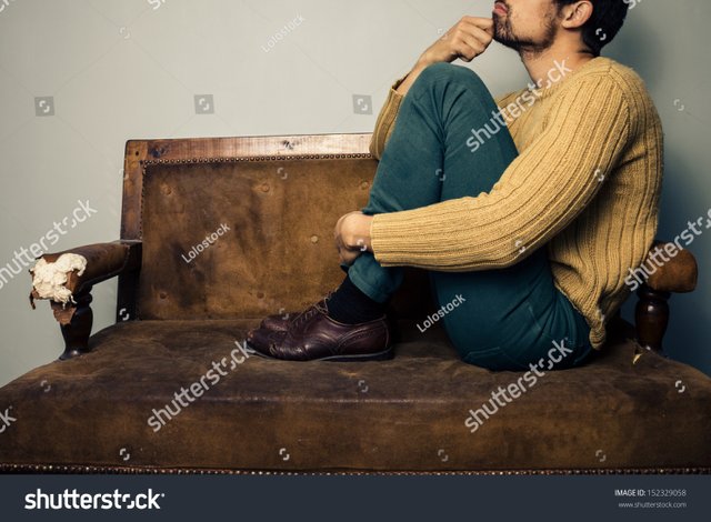 stock-photo-young-man-thinking-on-the-couch-152329058.jpg