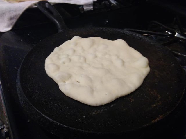 bread naan 14 cook on comal till bubbly.jpg