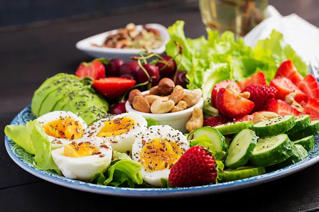 plate-with-paleo-diet-food-boiled-eggs-avocado-cucumber-nuts-cherry-strawberries-paleo-breakfast_2829-3702.webp