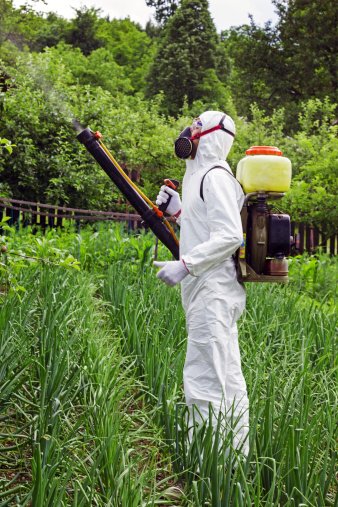 man-in-full-protective-clothing-spraying-chemicals.jpg