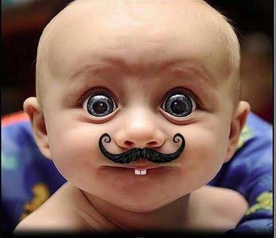 Funny-Kid-With-Big-Eyes-And-Mustaches.jpg