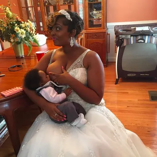 Proud-Mom-Breastfeeding-Her-Wedding-Day.webp