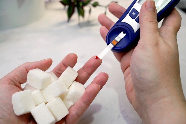 close-up-human-hand-with-glucose-meter_1048944-14817949.jpg