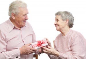Older-Man-Giving-His-Wife-A-Gift-300x204.jpg