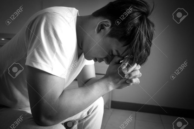 76158562-asian-man-with-sad-mood-in-the-room-sadness-portrait-concept-black-and-white-tone-.jpg