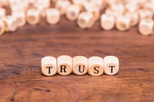 trust-word-made-with-wooden-blocks_23-2148101503.webp