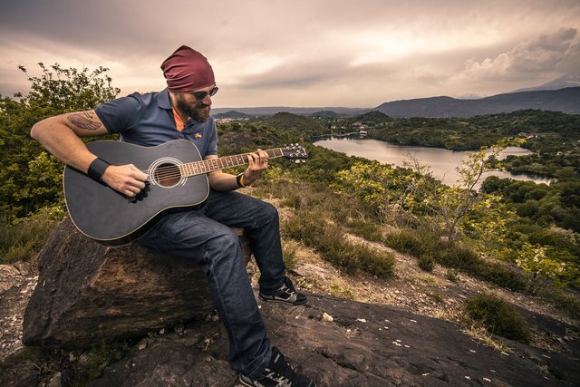 Guy Playing a Guitar.jpg