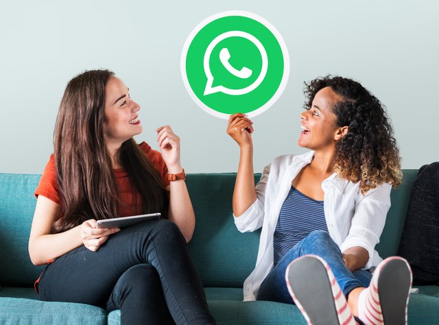 young-women-showing-whatsapp-messenger-icon.jpg