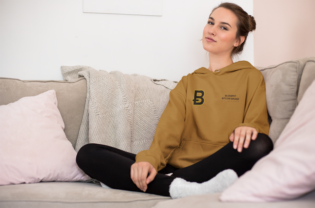 hoodie-mockup-of-a-young-woman-wearing-cozy-socks-on-a-couch-23203.png