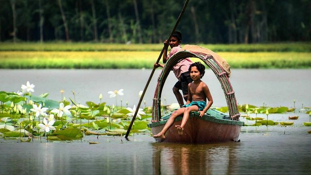 Small-boy-on-a-boat-in-the-Meghna-River-in-Bangladesh.jpg