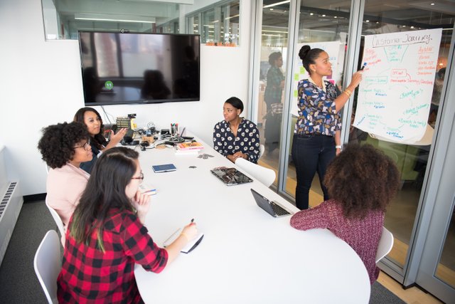 six-woman-standing-and-siting-inside-the-room-1181622.jpg